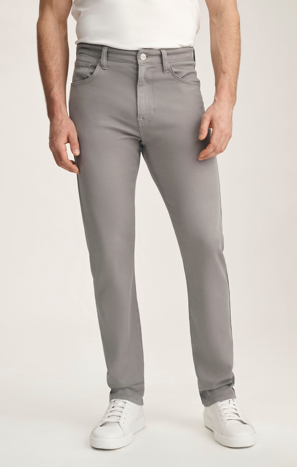 Courage Cloud Luxe pants worn with a white shirt and sneakers